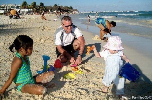 Little kids play on the beach in playa del carmen