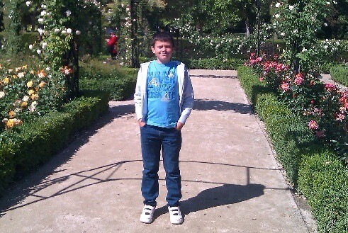 A tween in the gardens at retiro park, madrid