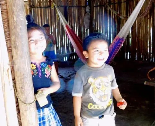 kids saying hello in their mayan village