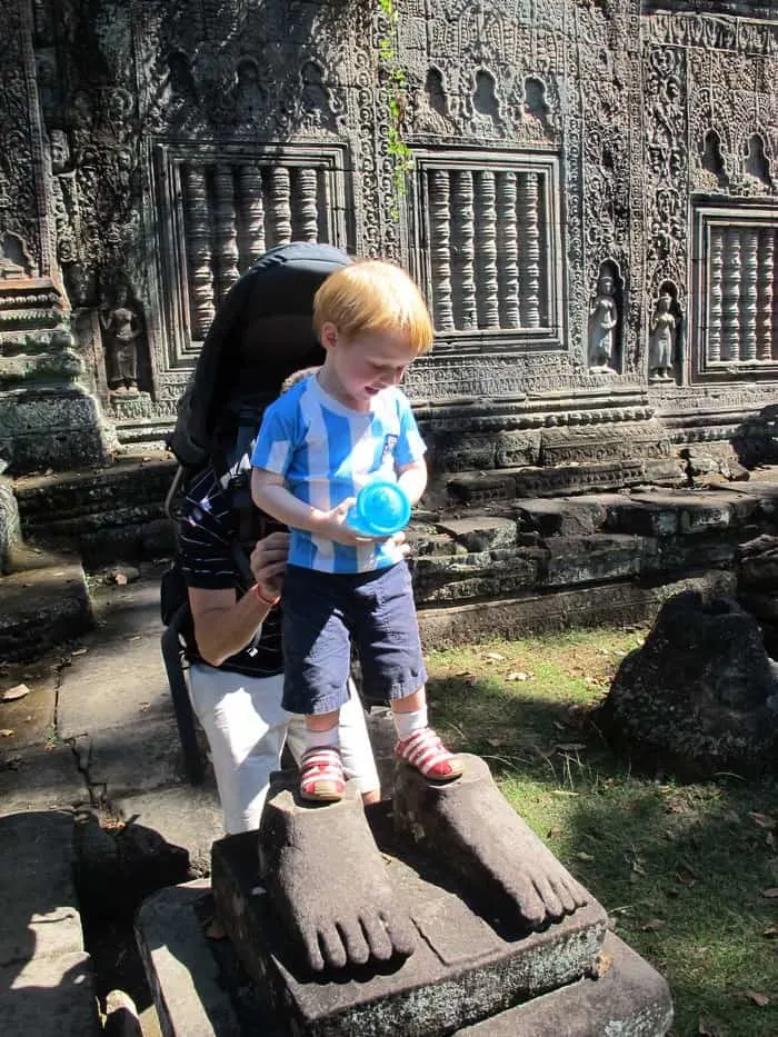 climbing on angkor's temples os ok. preah khan is safe even for smaller tots like this one.