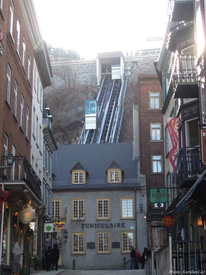 Cars going up and down the funicular in old town quebec.