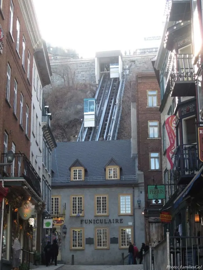 cars going up and down the funicular in old town quebec.