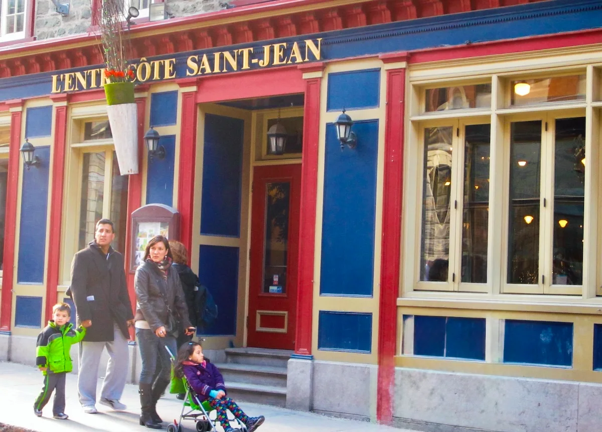Quebec City Weekend: 10+ Delightful Things To Do With Kids: A family strolls through the Old Town with kids, exploring the shops and restaurants.