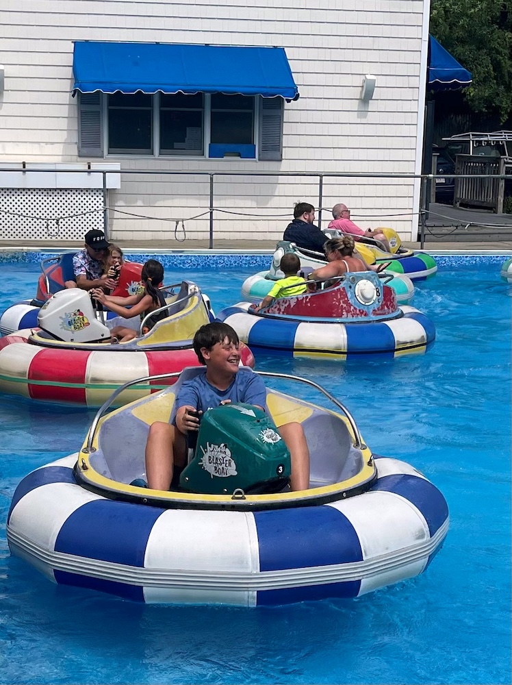 Kids, teens and adults like the water-shooting bumper boats at grand slam on cape cod.