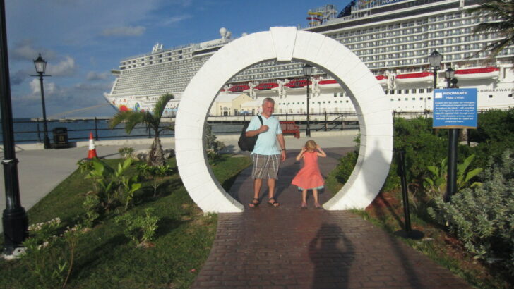 Here's The Complete Scoop On An NCL Breakaway Cruise With Kids: Review. Photo: Dad and daughter stand in front of the ship while docked in Bermuda