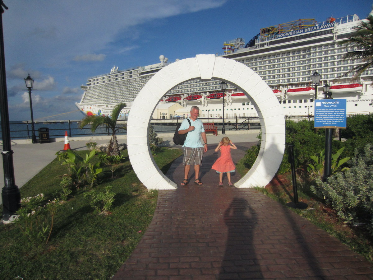 Here's The Complete Scoop On An NCL Breakaway Cruise With Kids: Review. Photo: Dad and daughter stand in front of the ship while docked in Bermuda