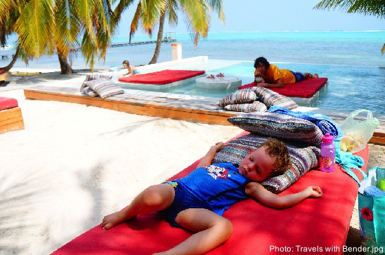 a few dollars gets you a prime beach spot for the whole day on ambergris caye. here a toddler naps in the sand.