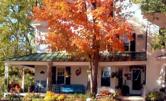 8 Places To Enjoy Spectacular Fall Foliage With Kids view fall foliage from the porch at the farm by the river in new hampshire