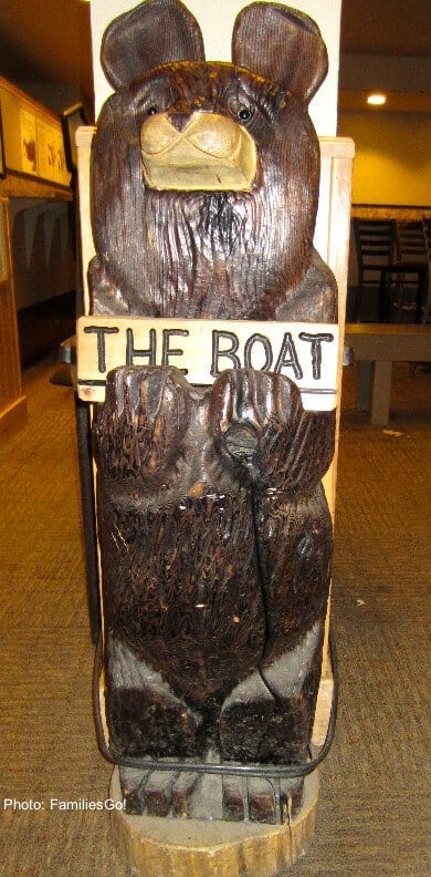the wooden steamboat bear greets skiers at the lodge.