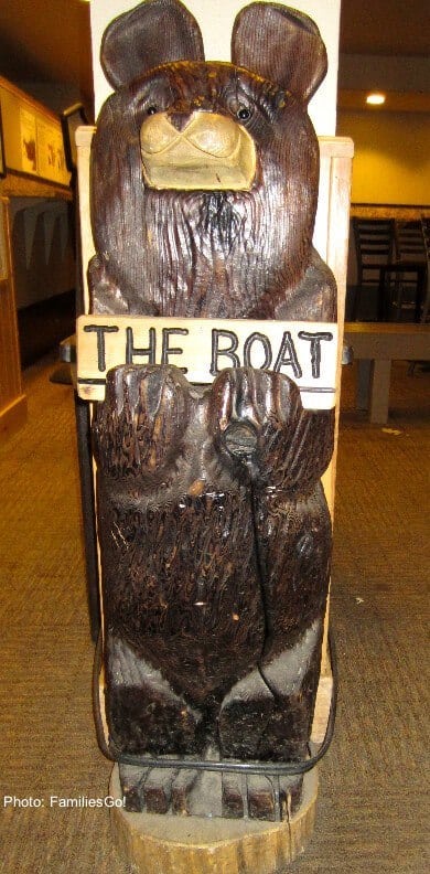 The wooden steamboat bear greets skiers at the lodge.