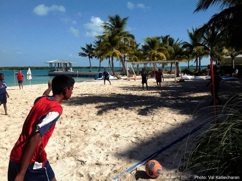 Turks And Caicos: 5 Terrifically Fun Things To Do With Teens Teen boys play beach soccer at grace bay, turks and caicos