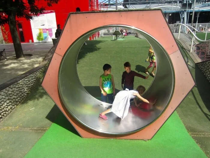 a large wheel a the playground at parc de la villette