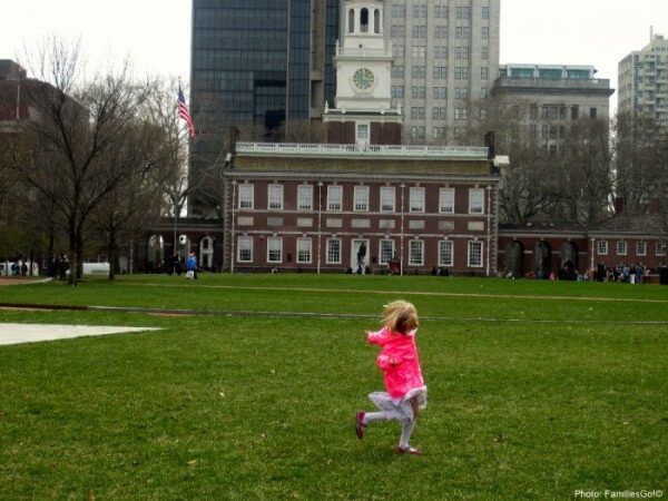 running on the lawn by independence hall in philadelphia