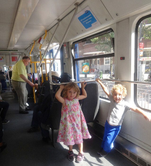 Two kids on the gvb tram in amsterdam