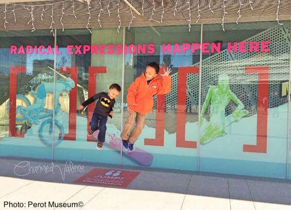 Kids jumping at the perot museum