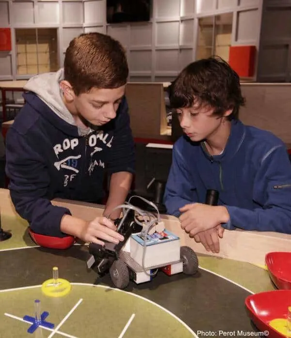 kids building cars at the perot museum