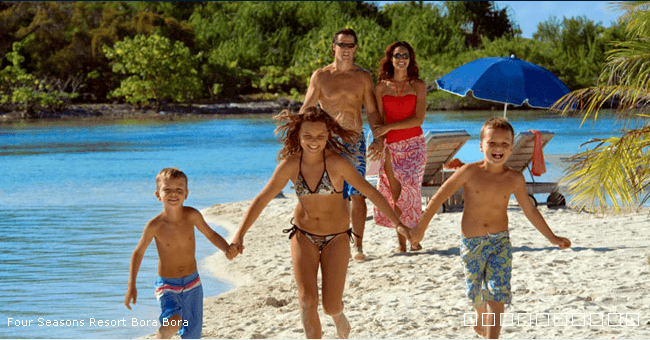 A Family On The Beach In Bora Bora