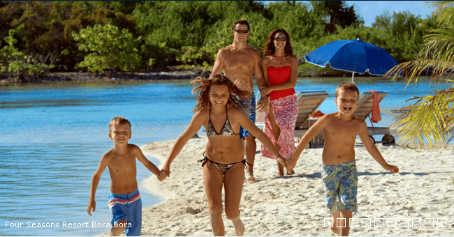 a family on the beach in bora bora