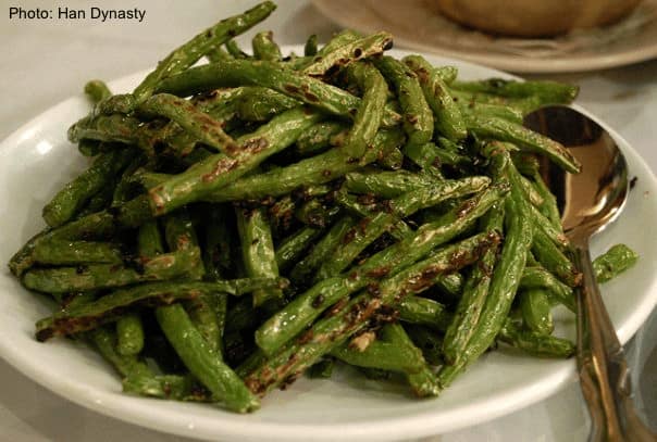 spicy string beans are one of the most popular dishes at han dynasty restaurant.