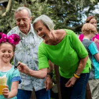 3 generations share a snack at disney World