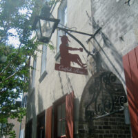 Charleston's famous Catfish Row sign hanging from a historic building.