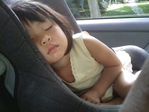 child napping in a car