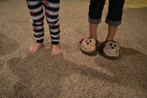 kids in pajamas and funny slippers, a nice way to spend your staycation.