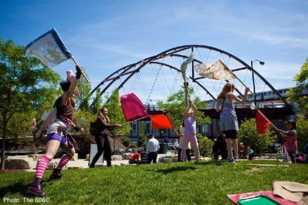 families take a break at t play area along the 606 trail in chicago.