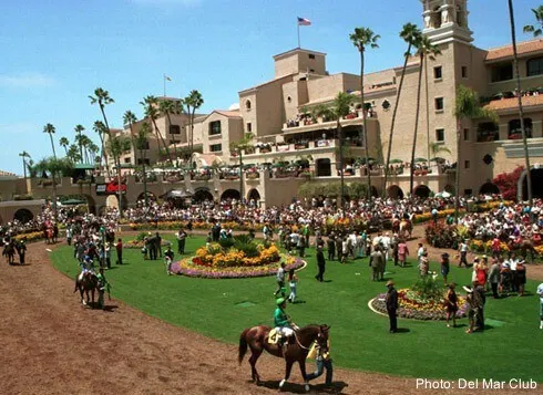 beautiful and historic del mar racetrack in southern california, has lawns and art deco buildings. 