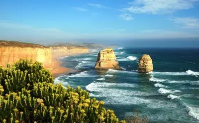 the great ocean road provides road cycling with a view