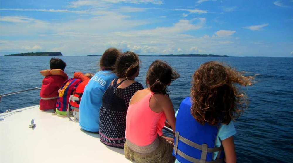 Children whale watching off the coast of panama