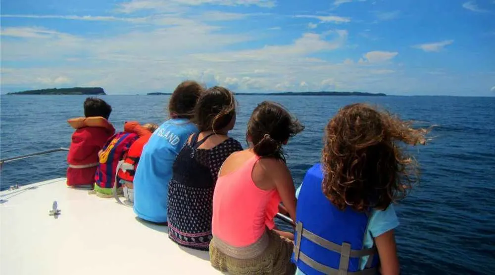 children whale watching off the coast of panama