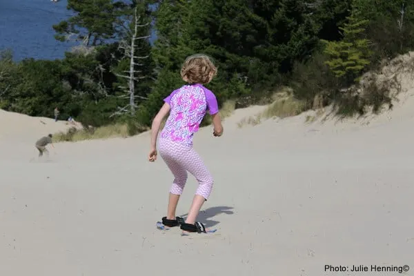 Oregon Coast Road Trip: What To Do &Amp; Where To Stay In 5 Popular Towns A girls plays in the oregon dunes, outside of florence, just off of oregon's coast route 101.