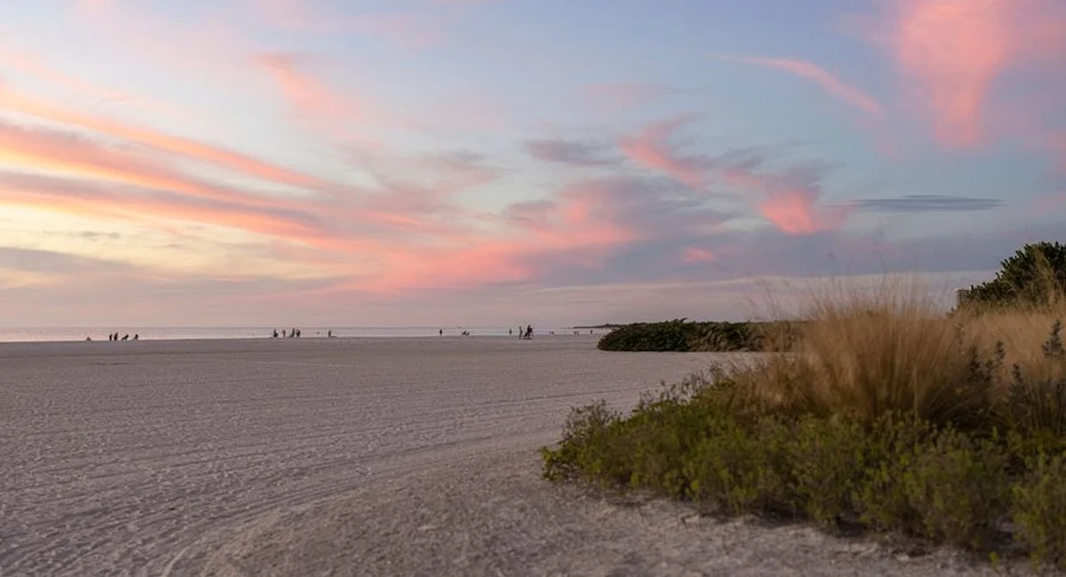 Marco Island Vacation: 5 Hot & Cool Things To Do With Kids: The pink sky of a sunset on Tigertail Beach on Marco Island.