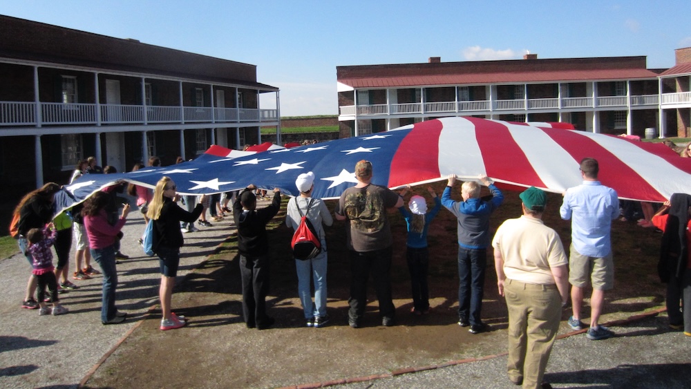Baltimore: 9+ Top Sights &Amp; Hidden Gems To Explore With Kids Visitors to fort mchenry in baltimore help raise a giant american flag every morning.
