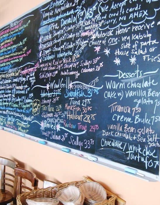 The daily menu and specials on the chalkboard at scales & shells