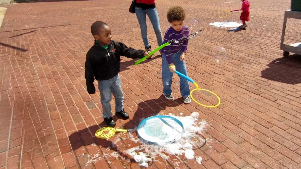 The science museum in baltimore has lots of hands-on things to do for all ages, like making giant soap bubbles outside.