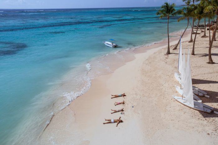 club med offers lots to do, including the chance to do nothing but lie on a lovely stretch of beach.