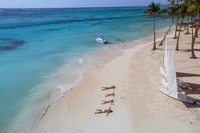 Club med offers lots to do, including the chance to do nothing but lie on a lovely stretch of beach.