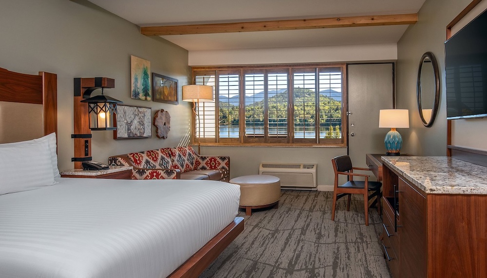 High peaks resort's rooms leave you space to move around and have big windows and stylish mountain decor.