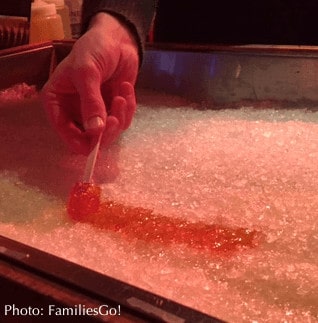 frozen maple syrup is eaten like a lollypop for an inexpensive street treat in montreal