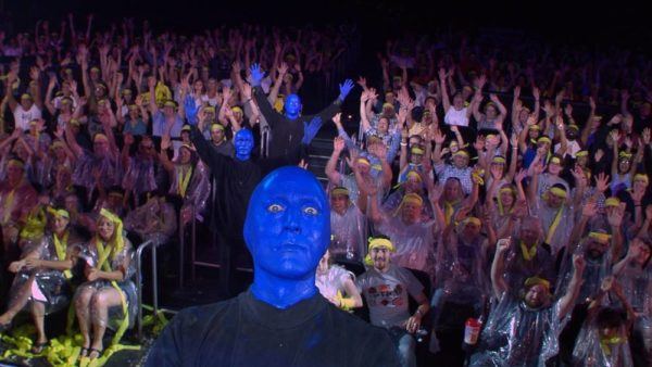 Bue man group takes selfies with the audience at many shows