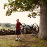 A man takes in the Gettysburg battlefield from Seminary Ridge.