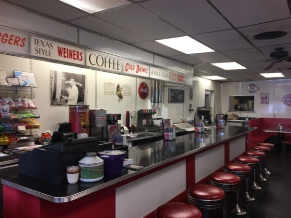 ernie's old fashioned lunch counter with signs for texas style weiners.