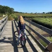 biking toward the ocean near kennebunk beach, maine