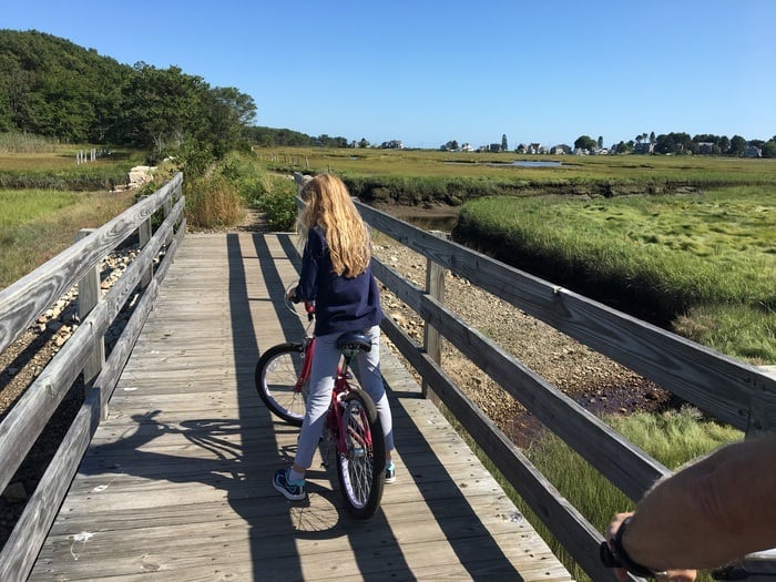 biking toward the ocean near Kennebunk Beach, Maine