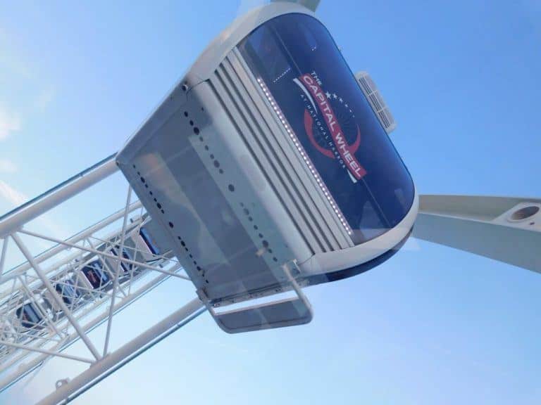 The capital wheel spins high above the national harbor, md