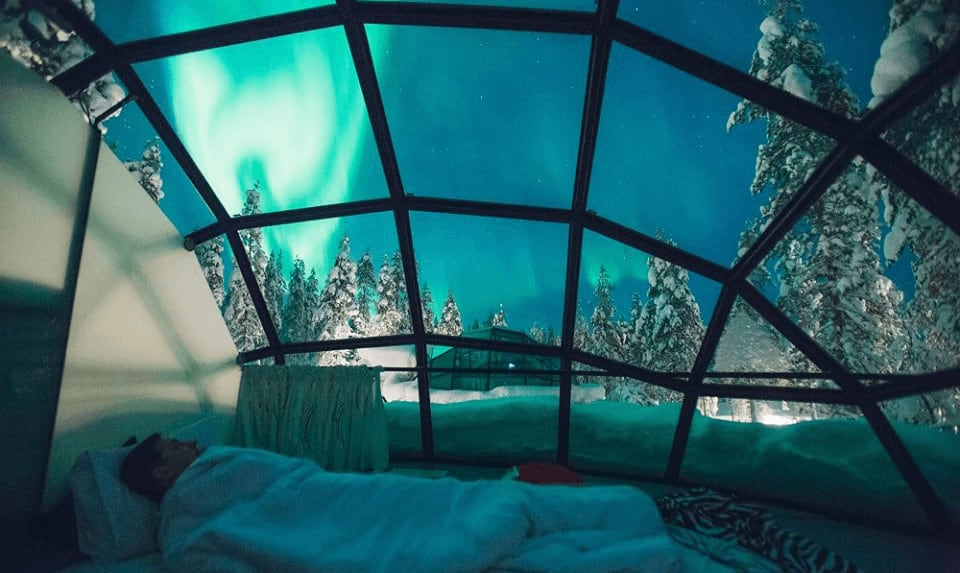 a snug way to see the northern lights, in a glass igloo in finland