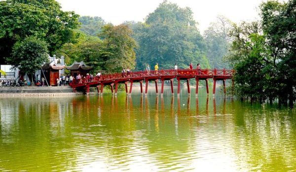 Huc bridge is lovely. The red bridge spans small lake.