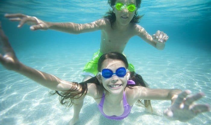 Tweens play in the water on grand bahama island